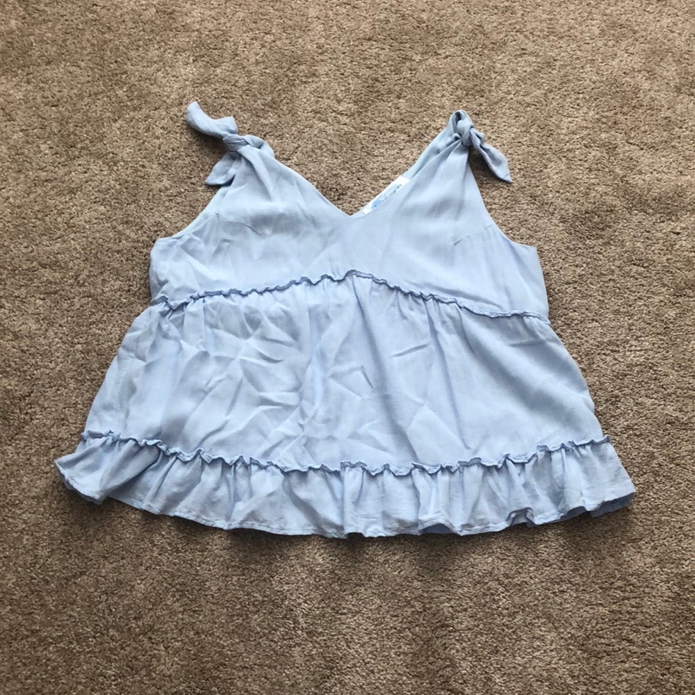 Ruffle tie sleeve top.